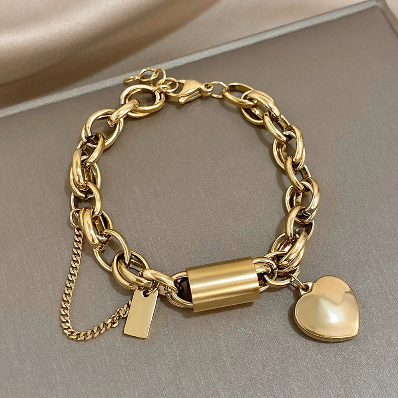 Livia Women's Heart Bracelet Twisted Chain Silver Tone - OutfitLondon